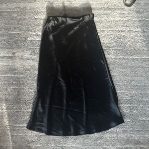 Aqua black satin elastic waist band skirt. Gently worn. 5’7 and lays at my calf